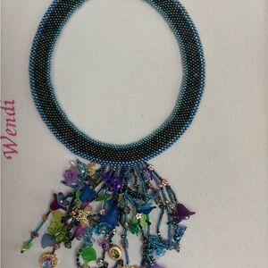 Elegant Beaded Necklace with Multicolor Charms floral garden statement necklace